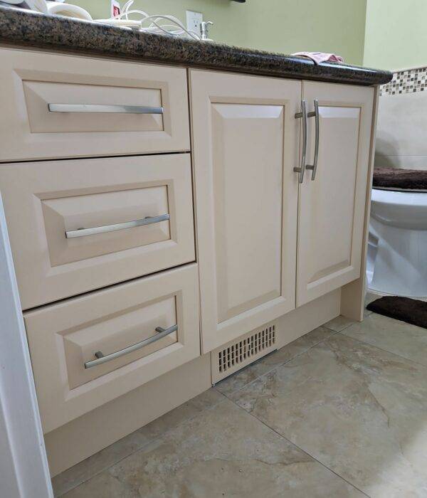 Close up of a beautifully refinished washroom cabinetry.