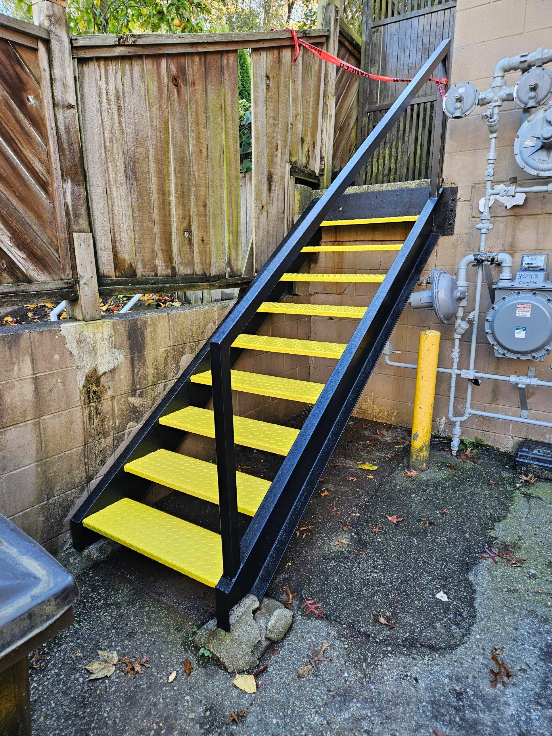 Close up of an exterior staircase with an epoxy coating complete