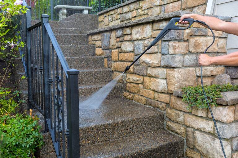 Pressure power washing the front entrance stair steps 92501644