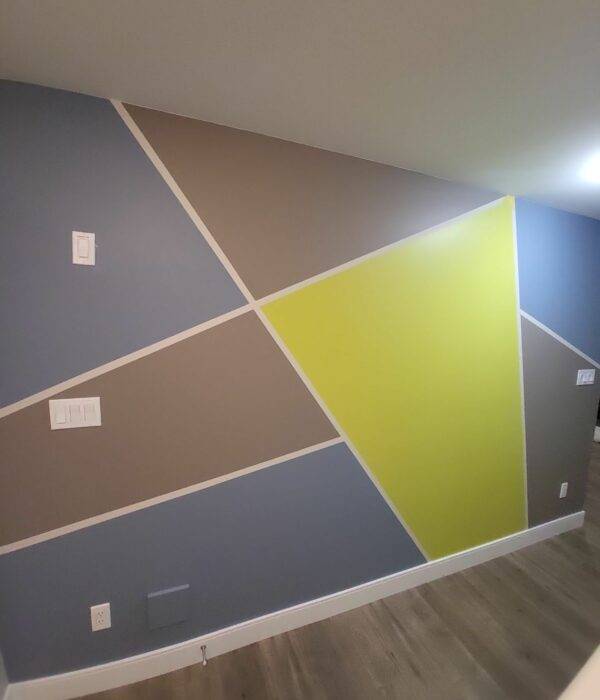 A basement wall that has a pattern of colours from oriah contracting interior painting services!