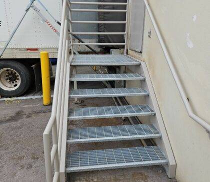 Close up of an exterior staircase with the welding repairs and coatings complete.